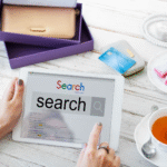 Person using a tablet to search online, representing research on the ideal meta description length for SEO.