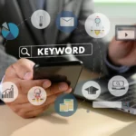 Business professional using laptop and smartphone with keyword ranking icons