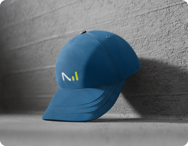 A blue baseball cap featuring a prominent logo of the letter "M" centered on the front.