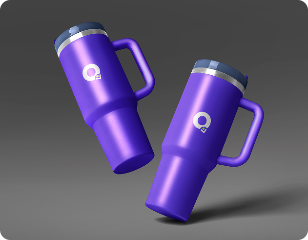 Two purple travel mugs featuring the Q logo prominently displayed on each mug.