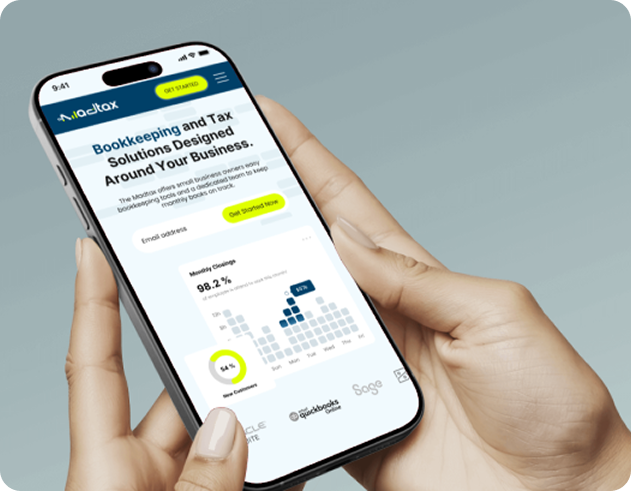 A person holds a smartphone displaying a MadTax app interface offering bookkeeping and tax solutions.