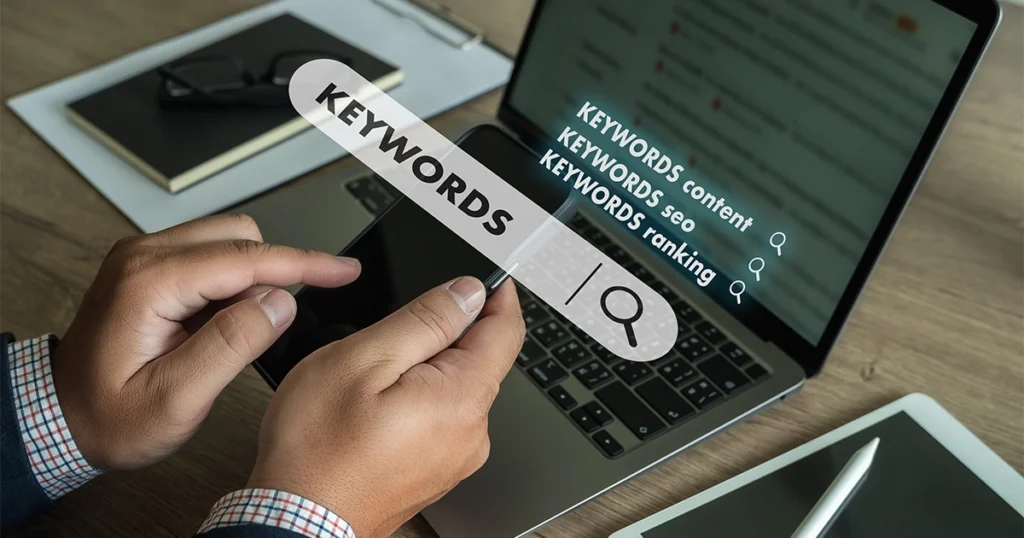 Person analyzing keywords on a laptop screen.